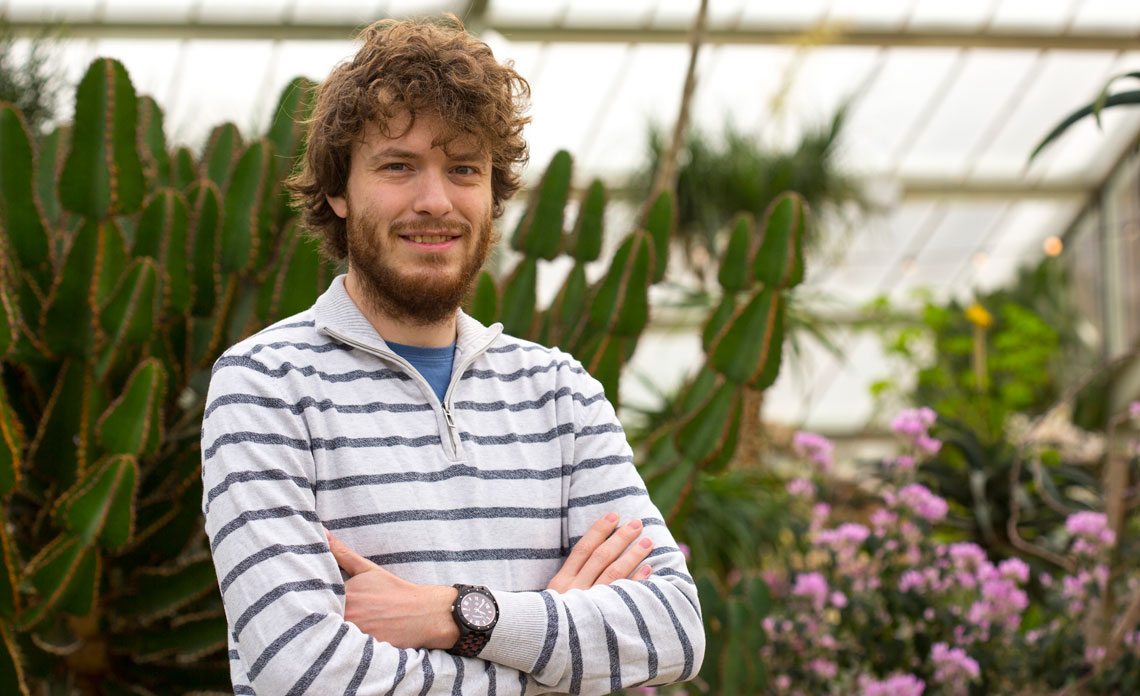 Yannick Woudstra standing in front of aloes in the PoW Kew