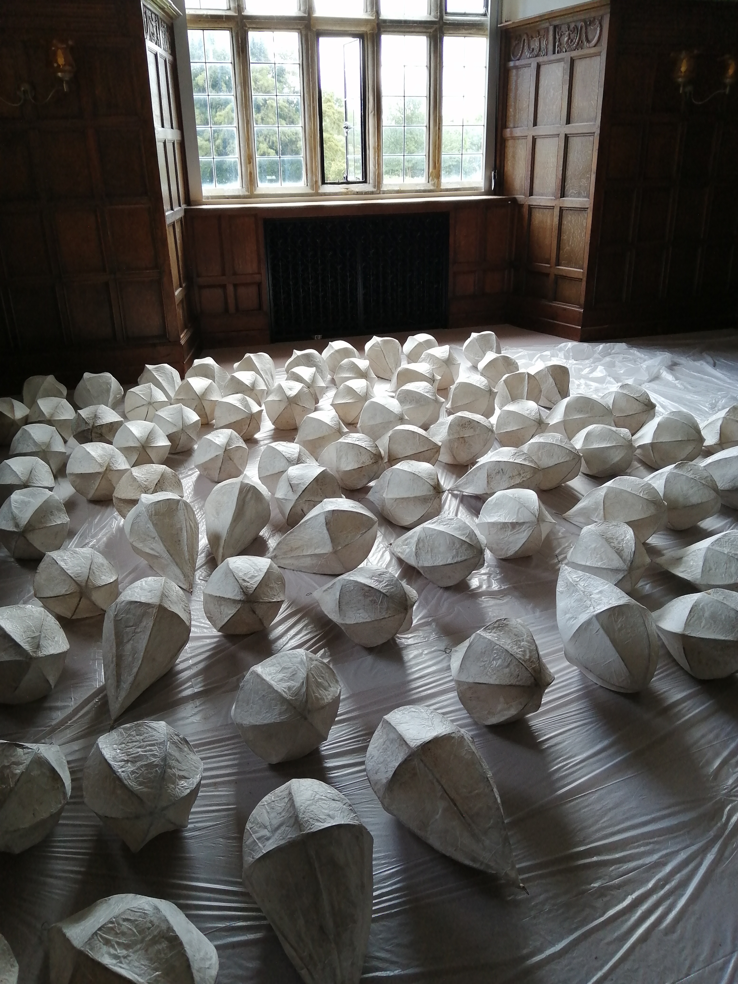 Lanterns laid out indoors, made by volunteers for Glow Wild 2021