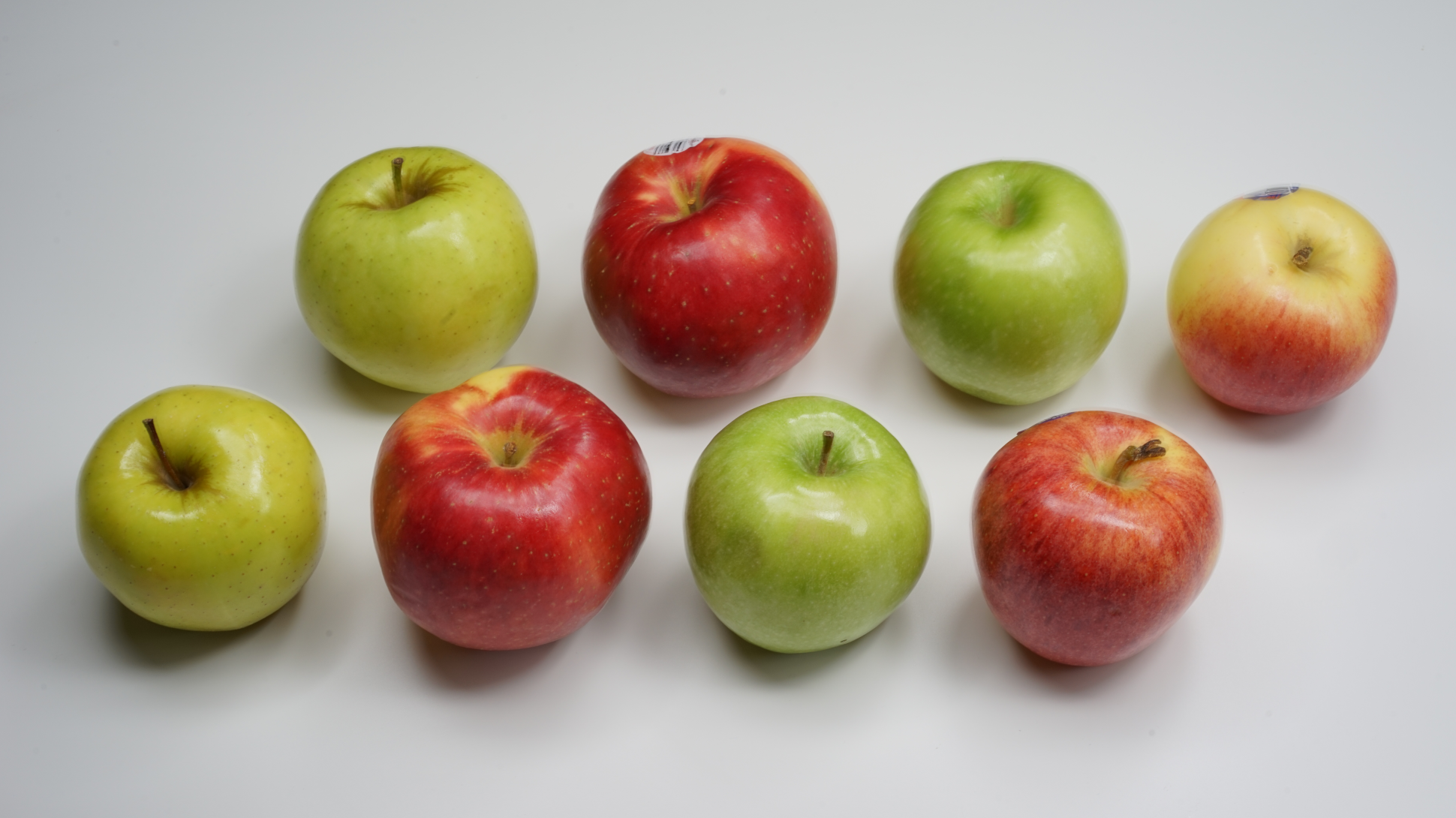 Several apples, both green and red, large and small