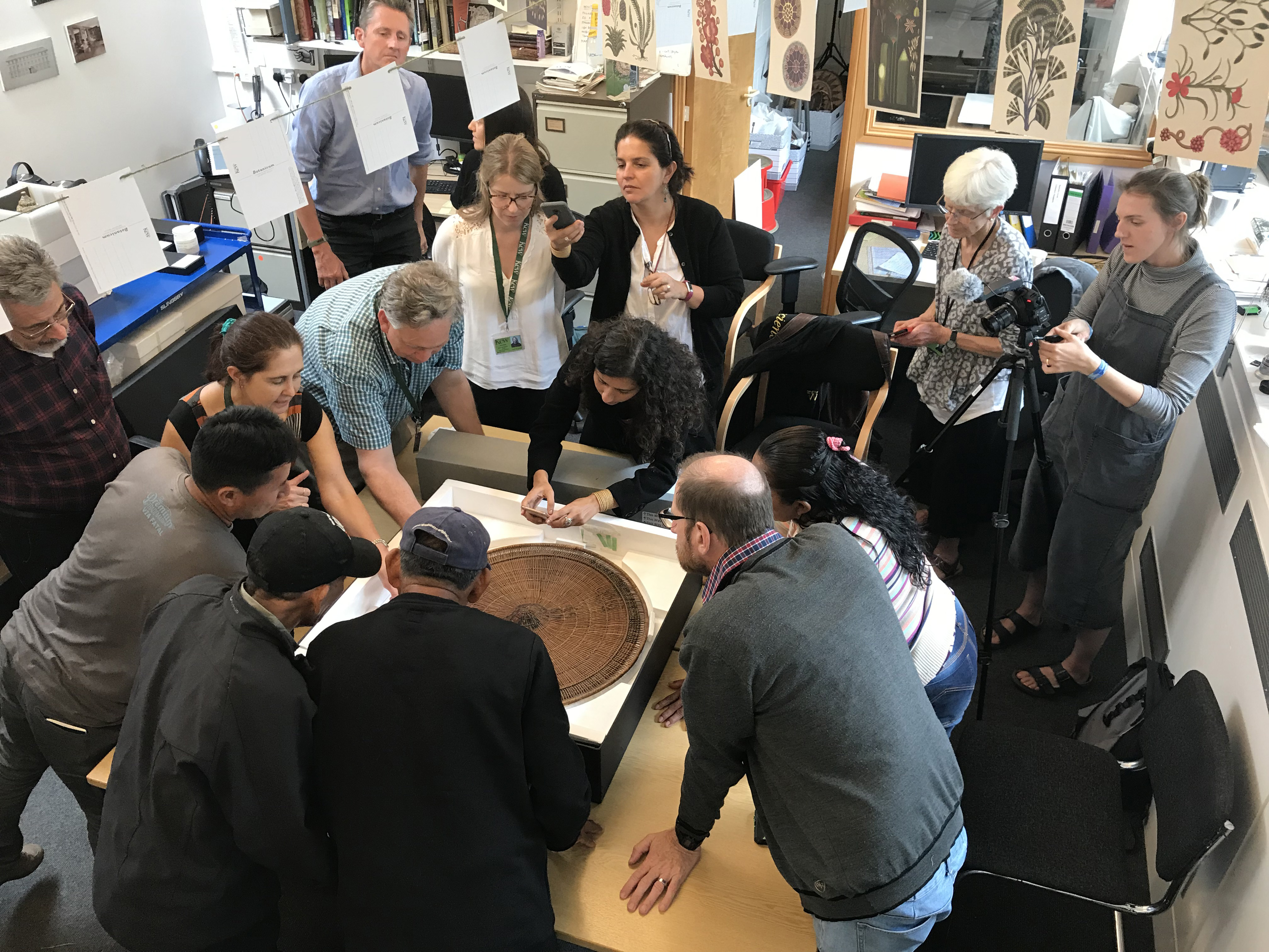 Indigenous visitors from the upper Rio Negro examine 19th-century artefacts from Amazonia at a transnational and interdisciplinary workshop at Kew in 2019