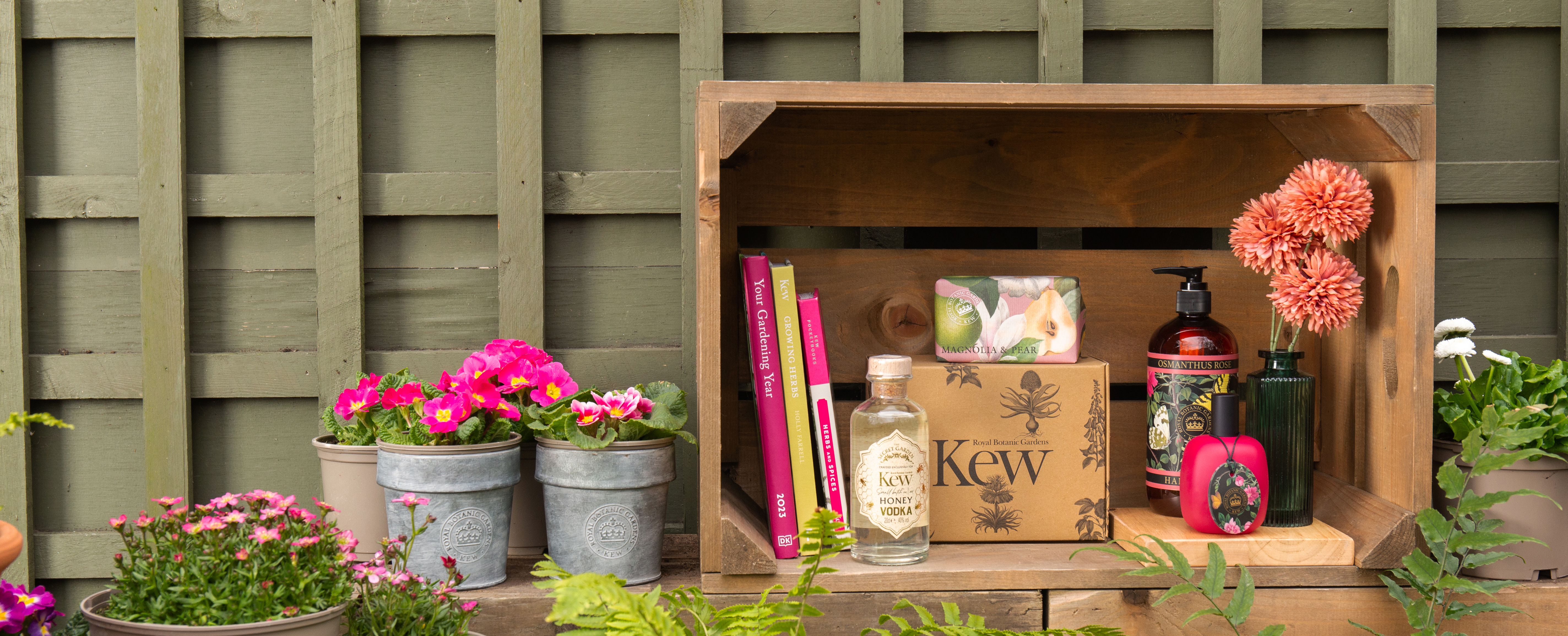 Attractive arrangement of pot plants, gardening books, Kew-branded toiletries and honey vodka in a wooden box