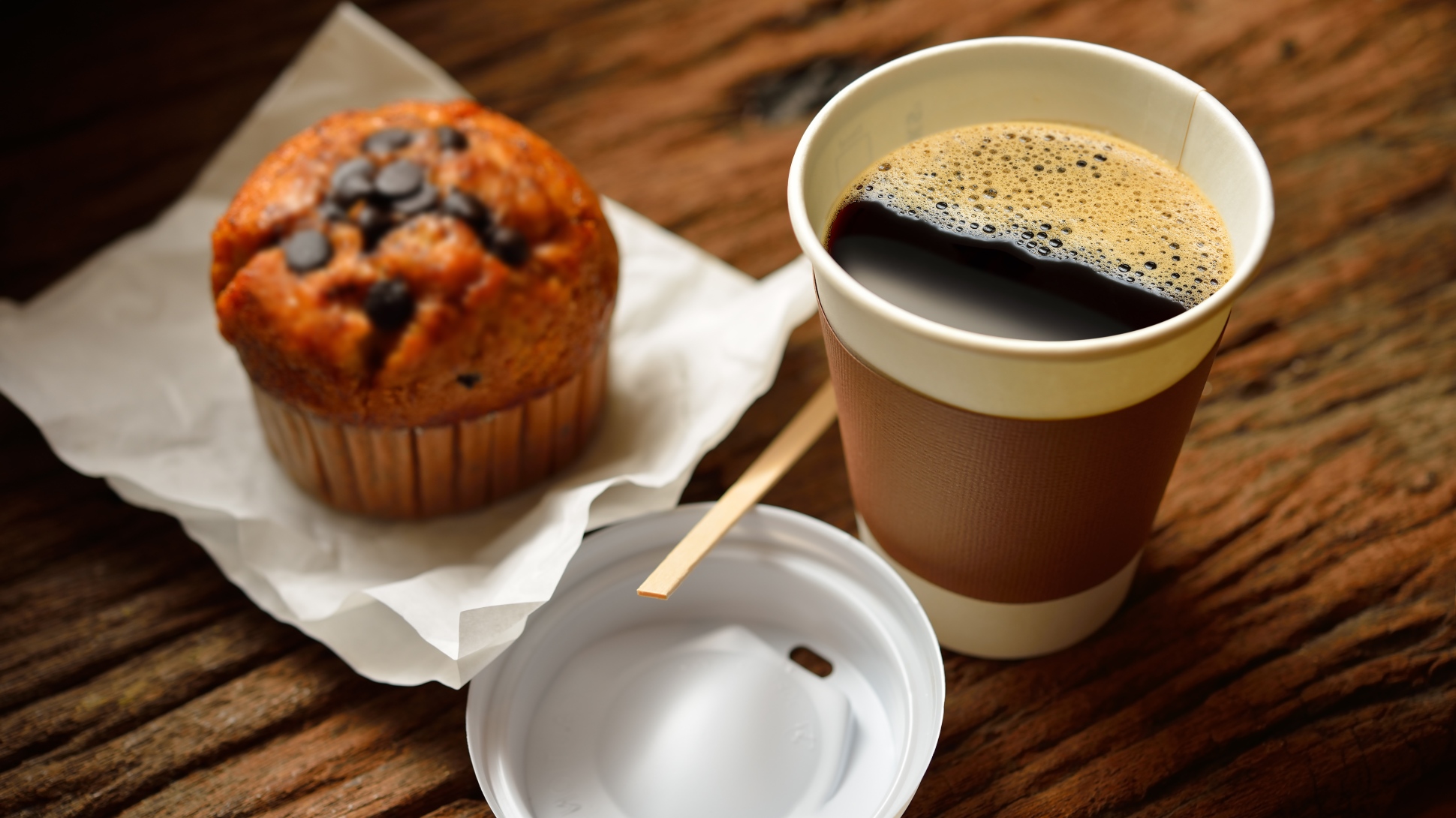 A muffin and a cup of coffee