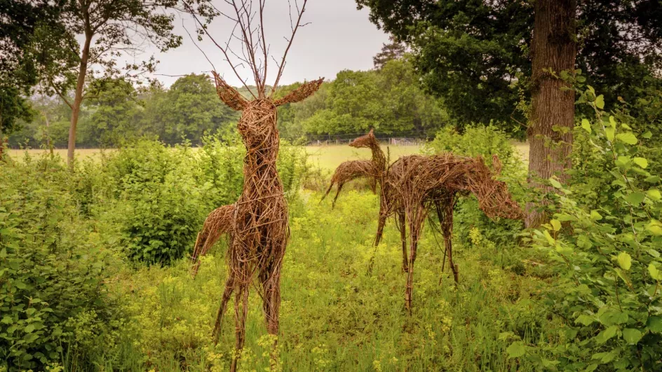 A trio of deer sculptures made from willow