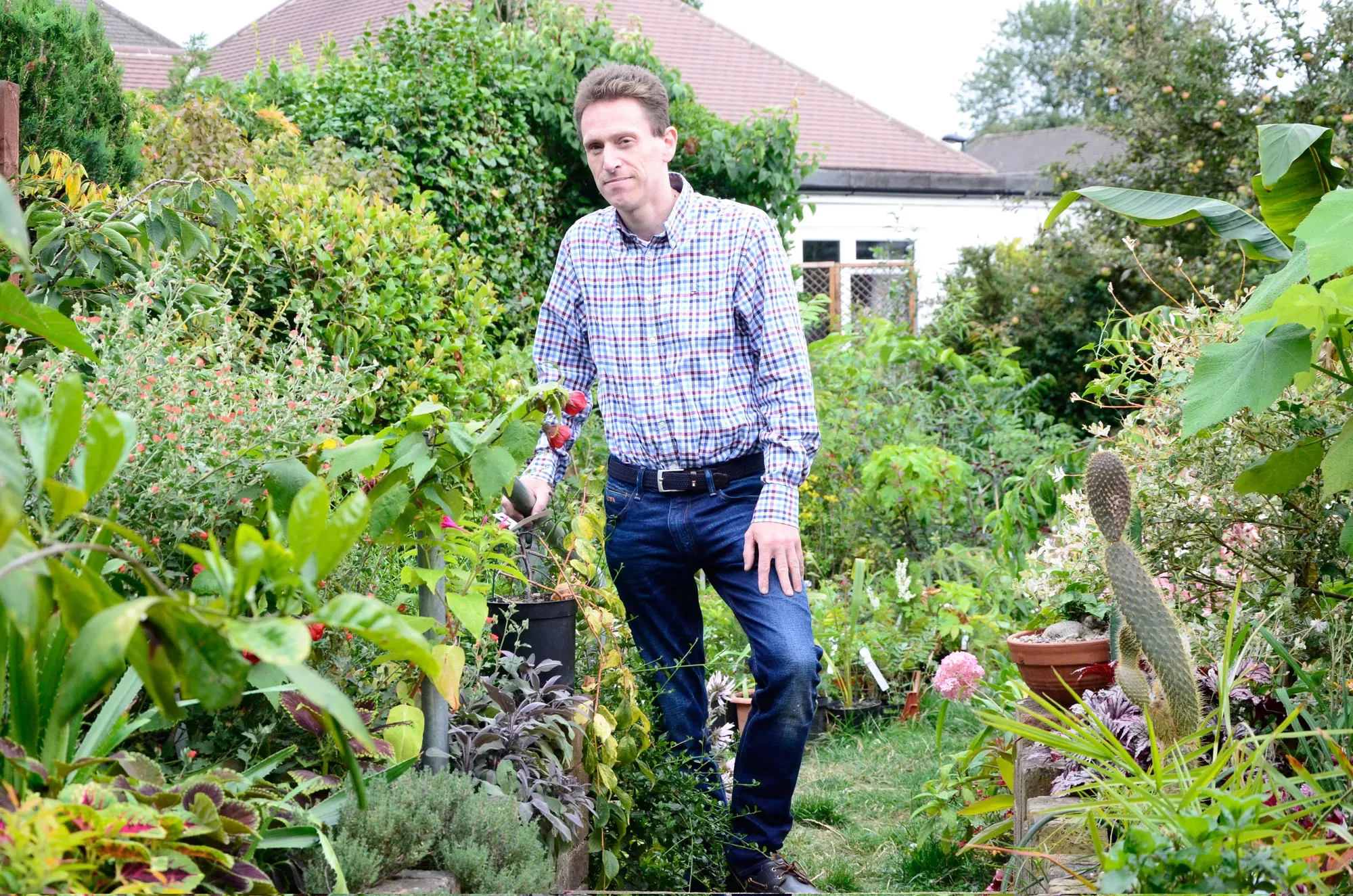 Rafael standing in a garden