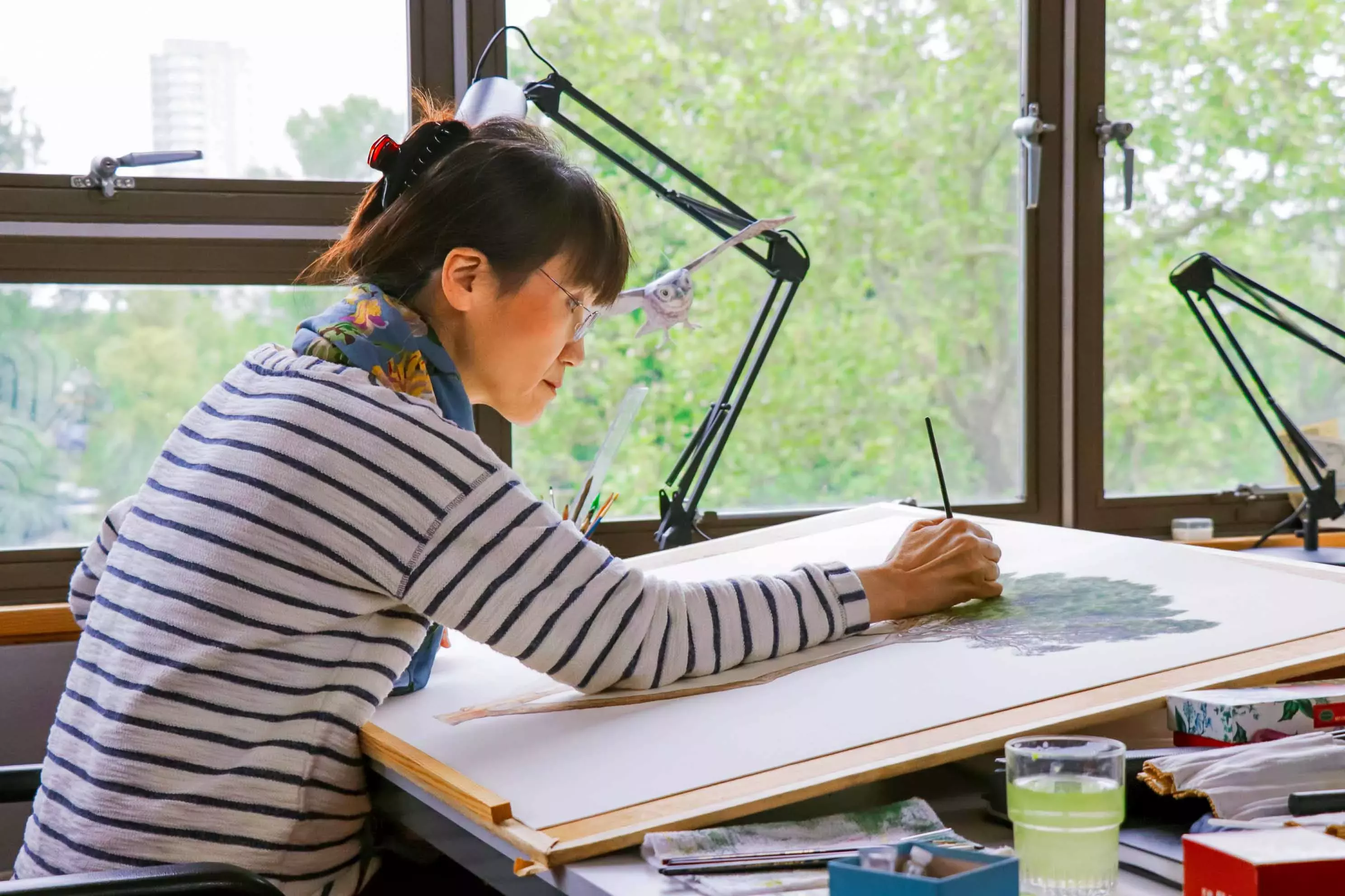 Botanical artist Masumi Yamanaka painting at her desk
