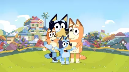 Cartoon dog character Bluey posing with her family in a park